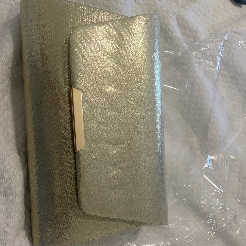 Large gold clutch handbag with gold chain